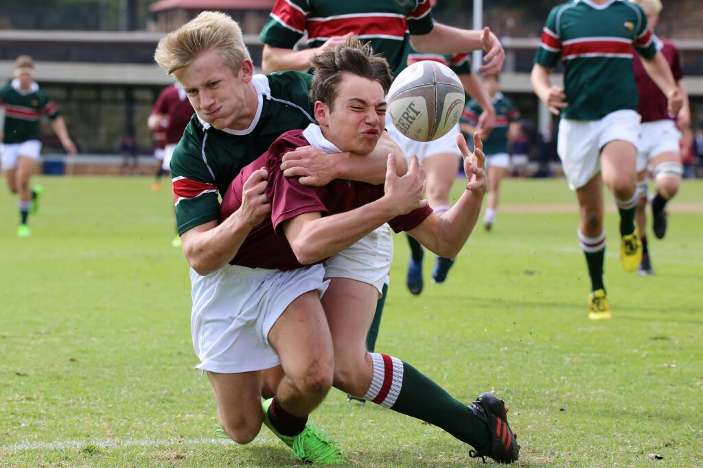 Players in action during a rugby match highlighting teamwork and competition.